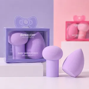 Detailed view of soft purple makeup sponges in a bow-shaped gift box packaging.