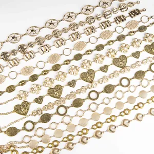 Collection of vintage gold-toned metal waist chains with floral and heart motifs