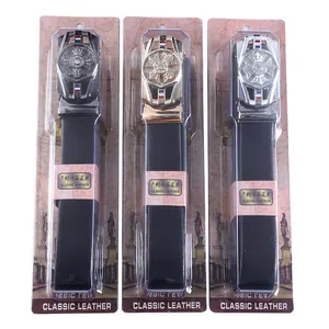 Detailed view of three vintage automatic buckle leather belts with rhinestone wheel design