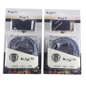 Detailed view of two elegant women's belts presented in their retail gift packaging