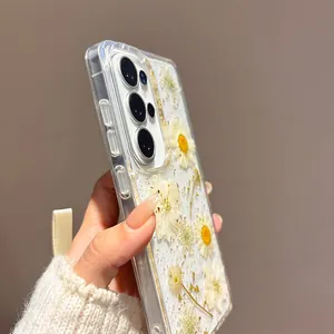 Detailed macro view of clear Samsung phone case with real dried daisy flowers and gold foil