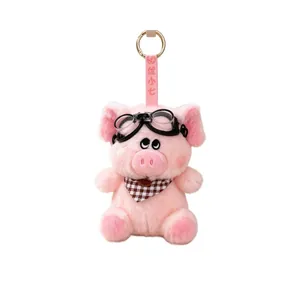 Cute pink plush pig keychain charm with vintage pilot glasses and a checkered scarf