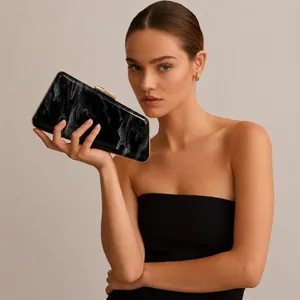Elegant black marble acrylic evening clutch bag featuring a stylish gold metal clasp
