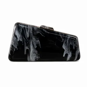 Detailed view of a stylish black and white marble acrylic evening clutch bag for women