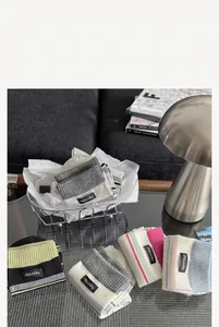 Detailed view of various color options for these striped combed cotton crew socks