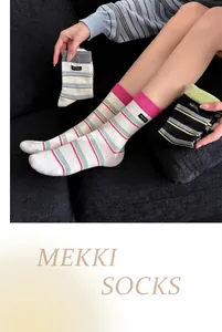 Detailed lifestyle view of breathable striped combed cotton mid-calf socks for women