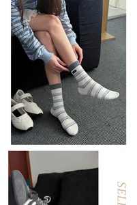 Close-up detail of breathable striped cotton crew socks styled with casual shoes.