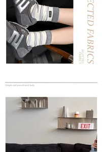 Close-up detail of striped combed cotton mid-tube socks for women in lifestyle setting.