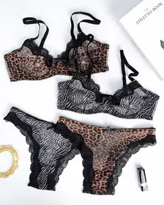 Detail view of leopard and zebra print lace lingerie set with mesh fabric.