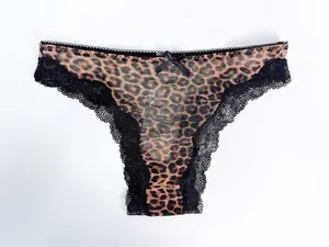 Detailed view of sexy leopard print panties with black lace trim and bow detail