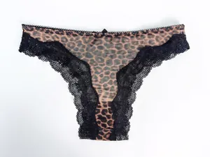 Detail of leopard print mesh panties with black lace trim and bow accent