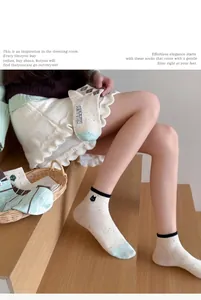 Detailed shot of cute Japanese style combed cotton socks with little cat embroidery