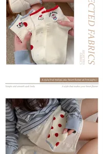 Detail of cotton short-tube socks with cute red cartoon puppy embroidery and dots