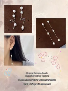 Détail de longues boucles d'oreilles pendantes en perles baroques argent S925