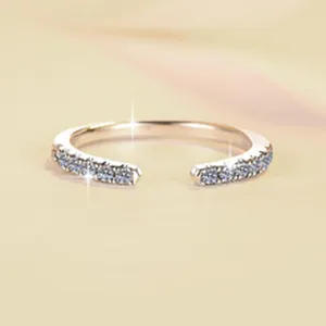 Macro view of S925 sterling silver open ring with pavé blue moissanite stones