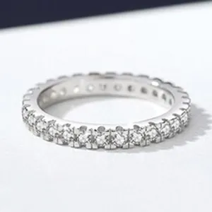 Close-up of S925 sterling silver eternity ring with single row moissanite
