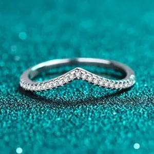 Close-up of a minimalist S925 silver V-shaped ring with sparkling moissanite stones