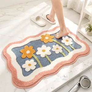 Soft flocked bath mat with cute floral design and absorbent non-slip backing.