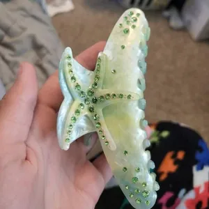 Bohemian starfish hair claw clip with green rhinestones for beach vacation style.