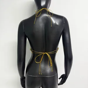 Back view detail of sexy gold rhinestone mesh halter top on black mannequin