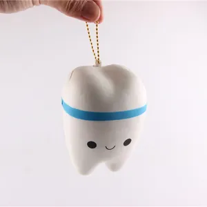 Detailed view of a smiling tooth squishy toy with slow rebound PU material