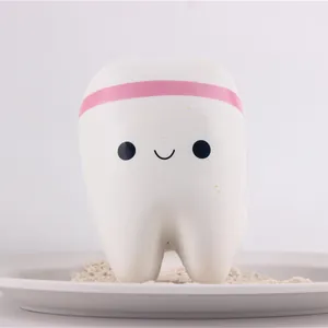 Close-up of a cute smiling tooth-shaped slow rebound squishy toy for stress relief.