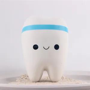 Detail view of cute smiley face on white PU slow rebound tooth toy squishy