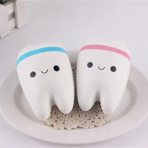 Detailed view of two cute smiling tooth-shaped slow rebound PU squishy stress toys
