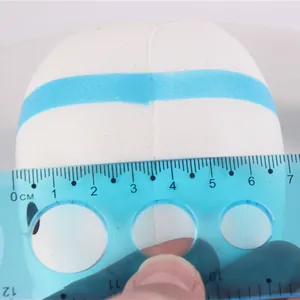 Detailed size measurement showing the width of white tooth squishy stress relief toy