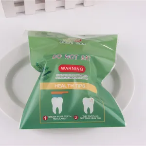 Detailed view of a green packaged tooth-shaped PU slow rebound stress relief squishy toy
