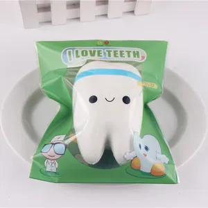 Detailed macro view of the cute cartoon tooth squishy toy in its original packaging