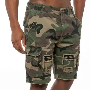 Detailed view of men's tactical camouflage cargo shorts with distressed stud patches.