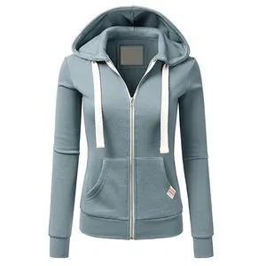 Detail shot of a women's blue zip-up hoodie with white drawstrings and pockets