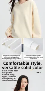 Detailed view of cream oversized crewneck sweatshirt with ribbed cuffs and hem stitching.