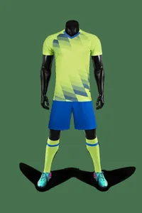 Full view of football training kit on mannequin showing neon yellow jersey and blue shorts