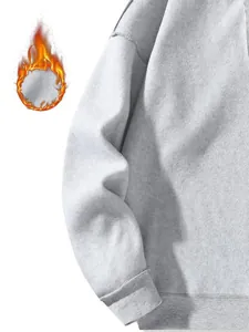 Detail view of heavyweight grey fleece hoodie showing soft texture and thermal warmth
