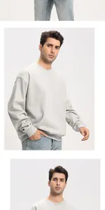 Close-up detail of a premium 380g grey heavy fabric crewneck sweatshirt on a model