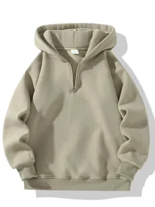 Detailed view of heavy khaki half-zip hooded sweatshirt with ribbed cuffs