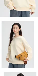 Detailed shot of 380g heavy fleece cream sweatshirt featuring relaxed crewneck style