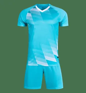 Turquoise soccer uniform set with jersey and shorts featuring geometric patterns