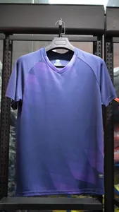 Close-up view of a professional blue and purple V-neck football training jersey.