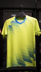 Breathable neon yellow soccer training jersey with geometric pattern and V-neck