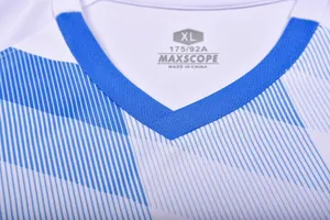 Close-up detail of football jersey neckline with XL tagless size label and blue trim.