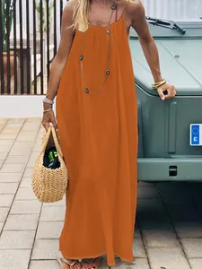Detail of vibrant orange ice silk crinkle pleated backless maxi dress for beach vacation