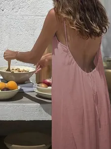 Detailed view of pink backless crinkle maxi dress with thin straps