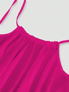 Macro detail of fuchsia ice silk crinkle camisole dress showing pleated neckline