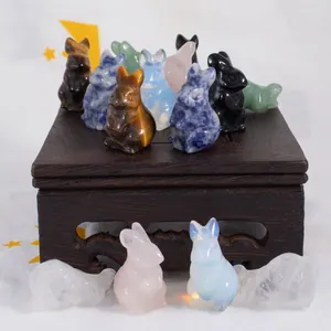 Macro view of hand-carved natural crystal rabbit figurines in assorted gemstones