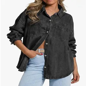 Detailed view of a women's washed black denim jacket featuring functional front pockets