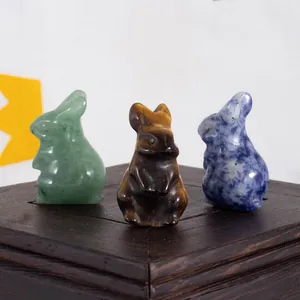 Hand-carved natural crystal rabbit figurines in green, tiger eye, and blue stones