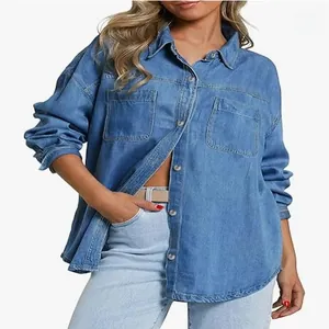 Detailed view of women's light blue washed denim shirt featuring dual chest pockets